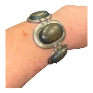 Silver tone and green/brown wood discs set in silver joined by 2 loops each. EE